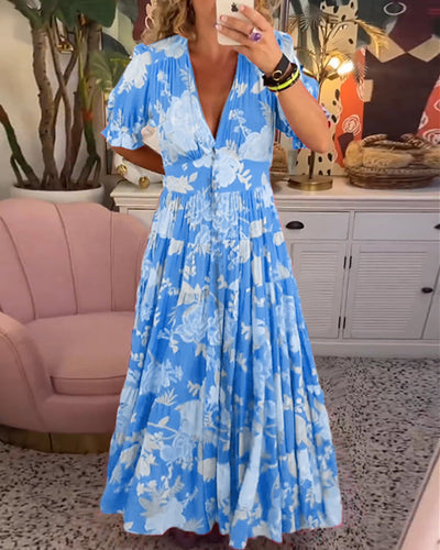 Daniela | Vestido con bolsillos, escote en V y estampado floral.